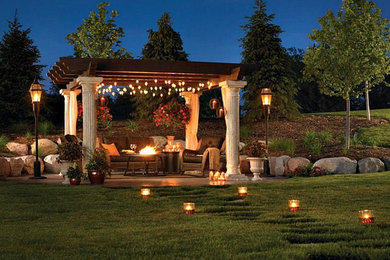 Patio - mid-sized transitional backyard tile patio idea in Toronto with a fire pit and a pergola