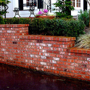 Inspiration for a backyard brick patio container garden remodel in Portland with no cover