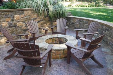 Inspiration for a mid-sized transitional backyard patio remodel in Other with a fire pit and no cover