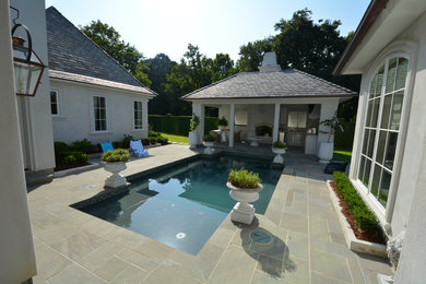 Design ideas for a medium sized contemporary back patio in New Orleans with tiled flooring and a gazebo.