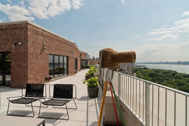 Patio - mid-sized contemporary backyard concrete paver patio idea in New York with no cover