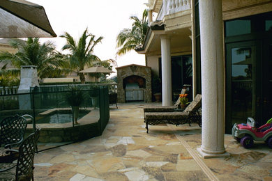 Island style patio photo in Miami