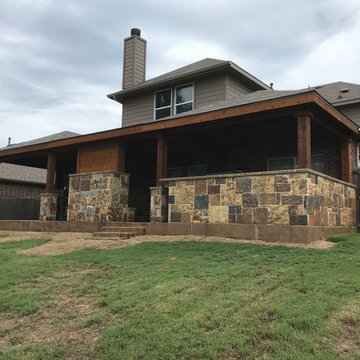 Rockwall - Hip patio cover, stamped concrete, 20' stone kitchen and fireplace.