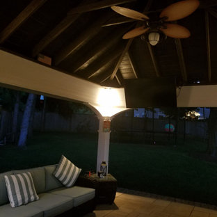 Large elegant backyard stone patio kitchen photo in Philadelphia with a gazebo