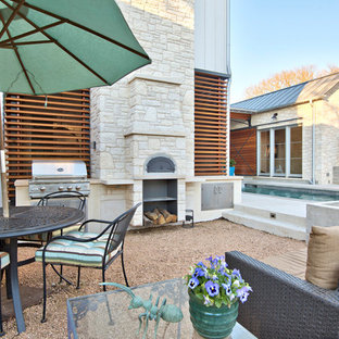 Patio kitchen - large transitional backyard decomposed granite patio kitchen idea in Austin with no cover