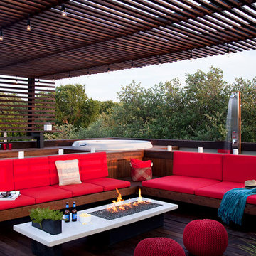 rooftop outdoor living with a hot tub and shower