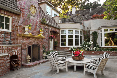 Patio - mid-sized traditional backyard stone patio idea in San Francisco