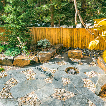 Rundle Stone and River Rock Patio with Fire Pit & Stone Seating