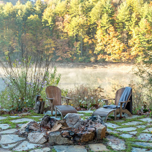 Inspiration for a rustic patio remodel in Other with a fire pit and no cover