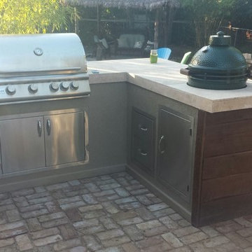 Rustic Reclaimed Wood Outdoor Kitchen with Green Egg & Firewood Box