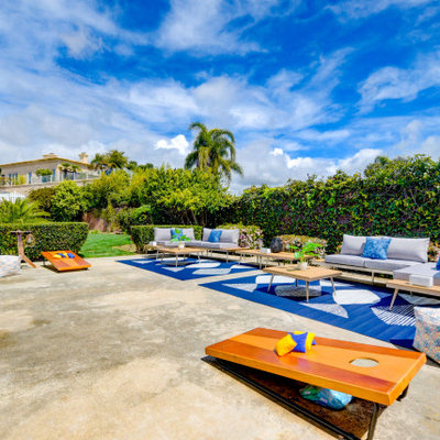Patio - large contemporary backyard concrete patio idea in San Diego with no cover