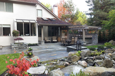 Example of a mountain style patio design in Seattle