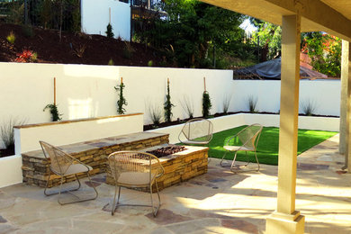 Patio - mid-sized transitional backyard concrete patio idea in Orange County with a fire pit and no cover