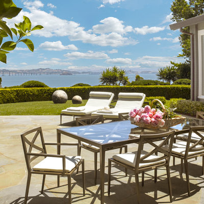 Inspiration for a large timeless backyard stone patio remodel in San Francisco with no cover