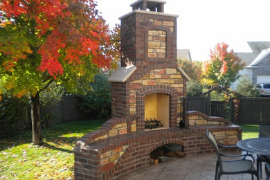 Example of a large arts and crafts patio design in Minneapolis
