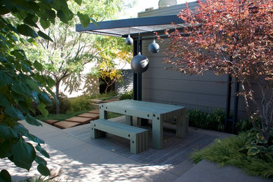 Patio - small modern backyard concrete patio idea in Denver with a fire pit and a pergola