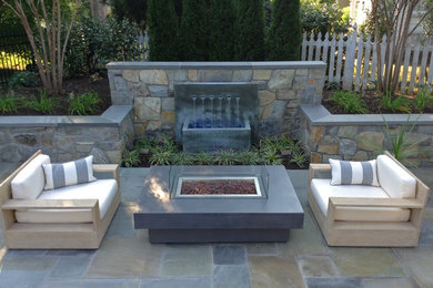 Mid-sized trendy backyard stone patio fountain photo in DC Metro with no cover