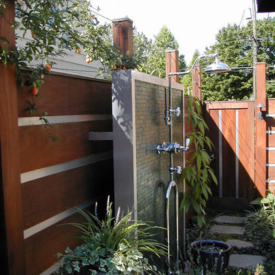 Example of a trendy side yard stone outdoor patio shower design in Portland