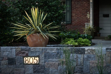 Inspiration for a contemporary backyard stone patio remodel in DC Metro