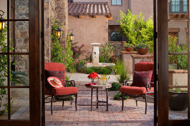 Tuscan backyard patio photo in Phoenix