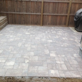 Mid-sized trendy backyard tile patio photo in Philadelphia with no cover