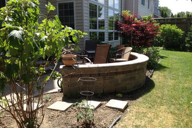Inspiration for a small timeless backyard concrete paver patio remodel in Cleveland with no cover