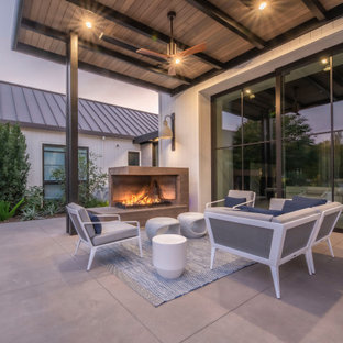 Foto di un grande patio o portico moderno dietro casa