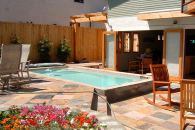Medium sized classic back patio in San Diego with tiled flooring and no cover.