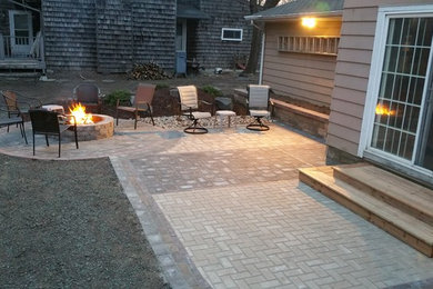 Patio - small traditional backyard concrete paver patio idea in Minneapolis with a fire pit and no cover