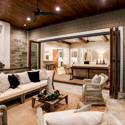 Patio kitchen - traditional backyard patio kitchen idea in Houston with a roof extension
