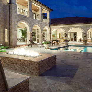 Tuscan patio photo in Austin with a fire pit and no cover