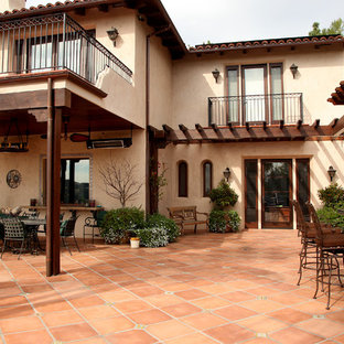 Tuscan patio kitchen photo in Los Angeles