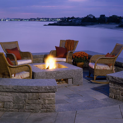 Example of a classic patio design in Boston with a fire pit
