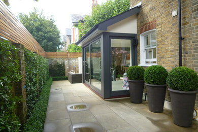 This is an example of a contemporary patio in London.