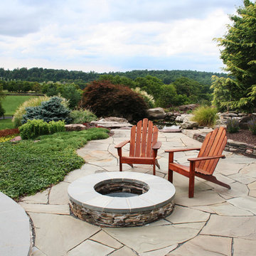 Stacked stone fire pit with seating area