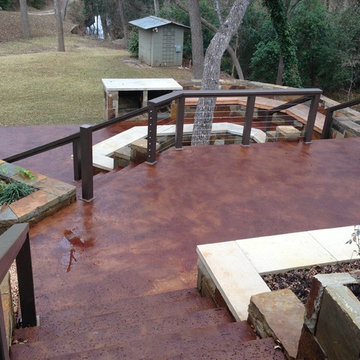 Stained concrete patio, Planter Walls  and Steel Wire Railing by Perfect Lawns