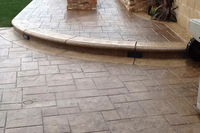 Large trendy backyard concrete paver patio photo in Los Angeles with a fire pit and no cover