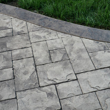 Stamped Concrete Patio with a Firepit & Seating Wall