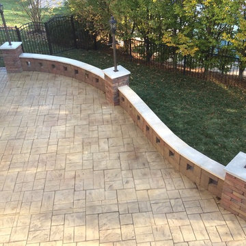 Stamped concrete patio with stamped brick edge.