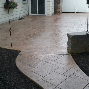 Stamped concrete patio with steps and sitting wall
