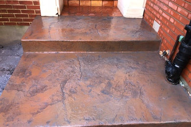Inspiration for a front yard stamped concrete patio remodel in St Louis