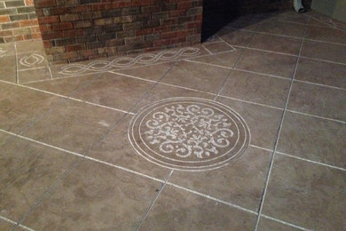 Example of a mid-sized backyard stamped concrete patio design in Other with a fire pit and no cover
