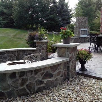 Stamped Patio with retaining wall and outdoor fireplace