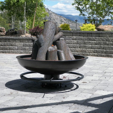 Steel cauldron fire pit with steel logs
