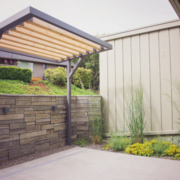 Steel + Cedar Shade Arbor and Garden Wall with Natural Stone Veneer