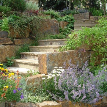 Steps in natural stone retaining wall