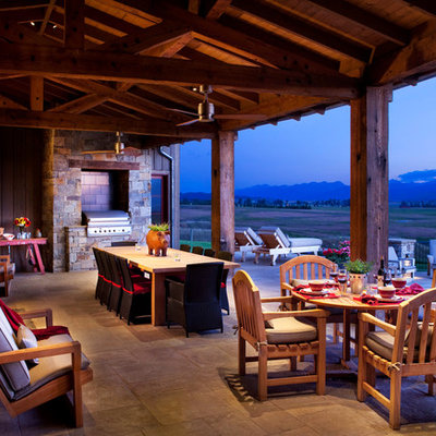 Patio - rustic patio idea in Other with a roof extension