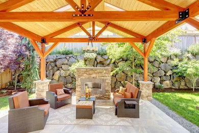 Large transitional backyard tile patio photo in Charlotte with a fire pit and a gazebo