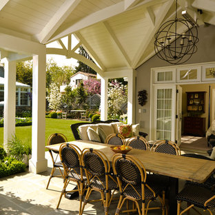 Example of a classic patio design in San Francisco with a roof extension