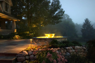 Inspiration for a timeless backyard patio fountain remodel in Other with no cover